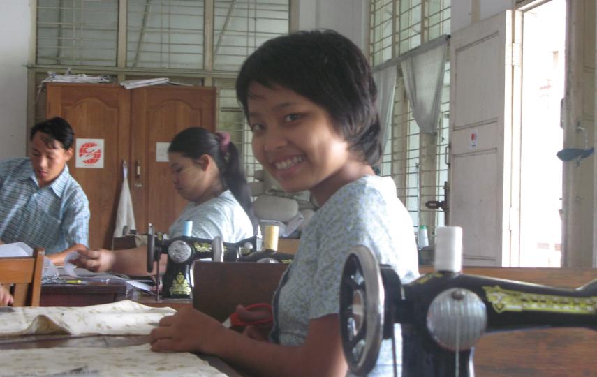 Thung Mai, 21, disabled by polio, learns tailoring at a vocational training centre for the disabled in Yangon, Myanmar, June 9, 2009