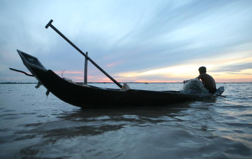 A fisherman plying his trade on the waters of the Tonle Sap lake, Cambodia. The lake is Cambodia’s largest and provides income to tens of thousands of families but the traditional fishing industry here is under threat from climate stresses and commercia