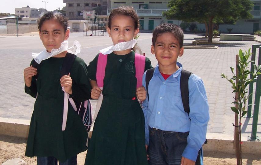 Students from the Abd El-Rahman Ibn Ouf Elementary School in Gaza City, where shattered windows and cracked walls remain as a result of the Israeli offensive that ended 18 January