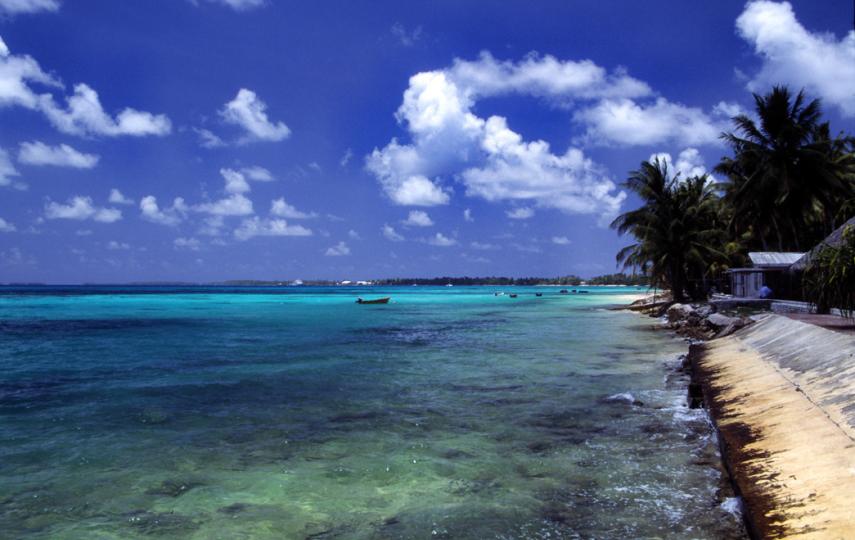 A beach at Funafuti atoll, capital of Tuvalu, a Polynesian island nation located in the Pacific Ocean, midway between Hawaii and Australia. With a population of less than 12,000, Tuvalu is likely to disappear in the future because of rising sea levels