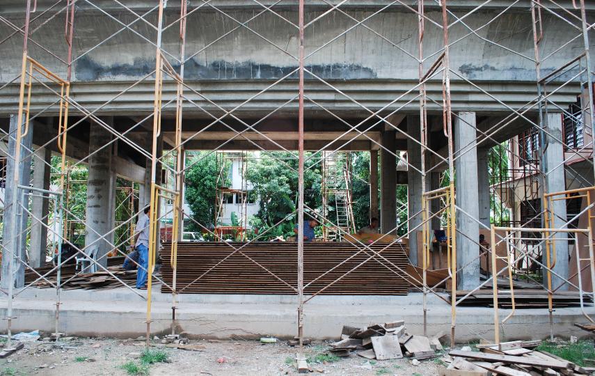Burmese migrant workers at a construction site for a new pagoda in the compound of the Burmese Buddhist temple in Penang, Malaysia