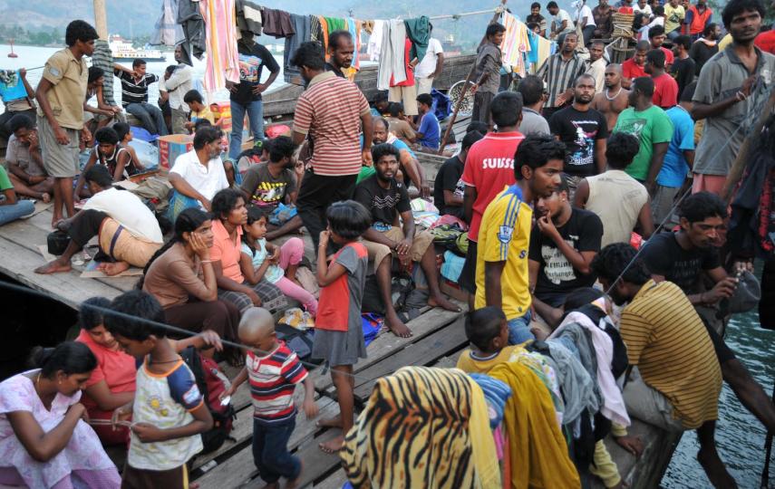 Some of a group of over 250 Sri Lankan asylum-seekers on their boat moored at Merak Port in the province of Banten, West Java. They were intercepted by the Indonesian navy in the Sunda Strait on their way to Australia