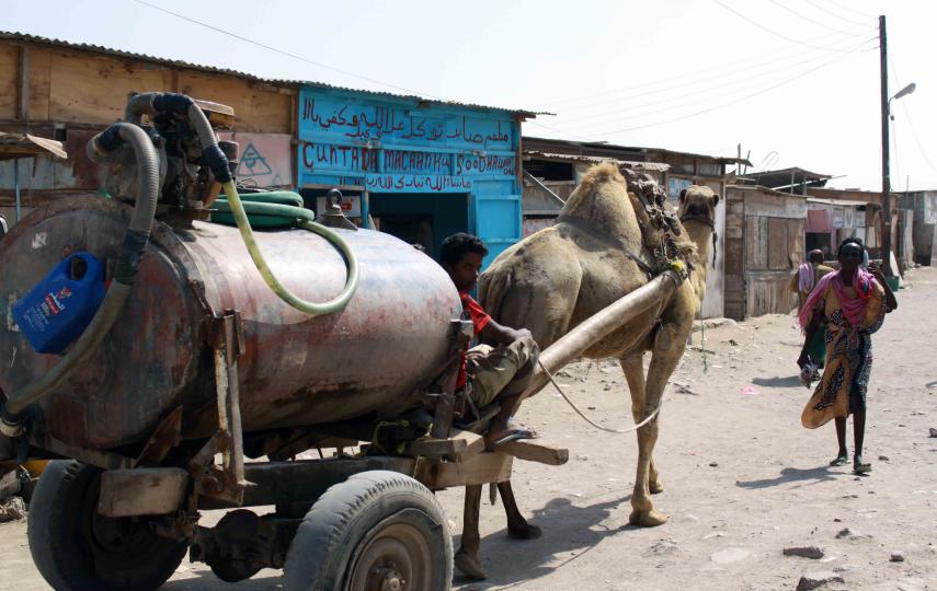 A vendor selling water in Basateen