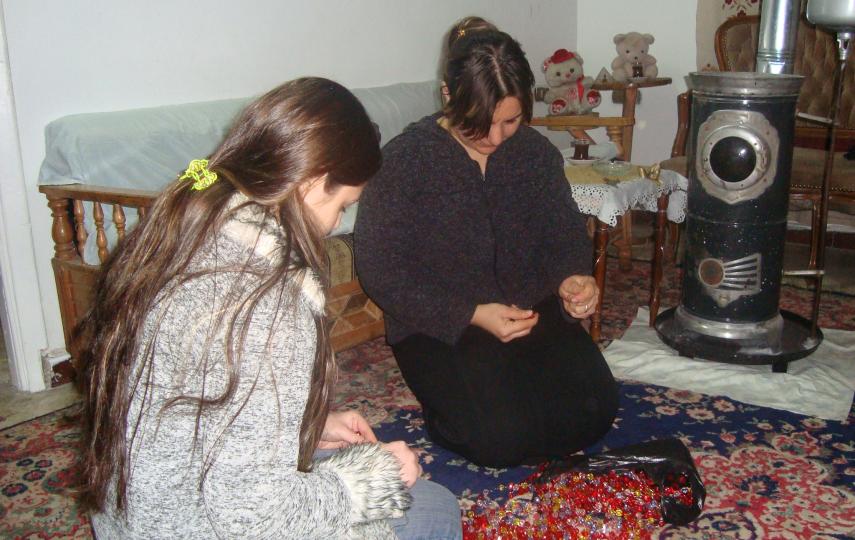 Aseel (left) and her mother working at home