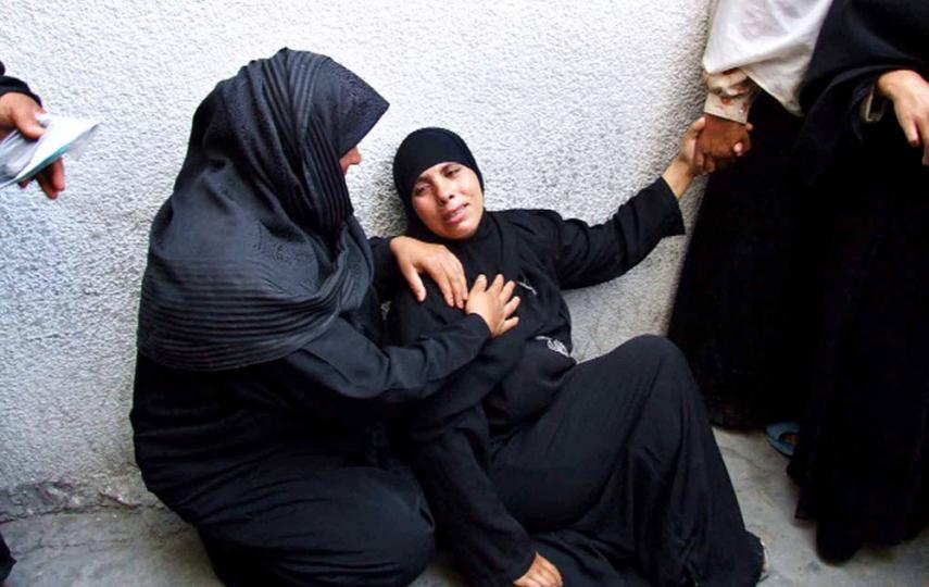 A woman cries after the loss of one of her sons in Kamal Adwan Hospital in the Gaza Strip. Palestinian women face a variety of hardships