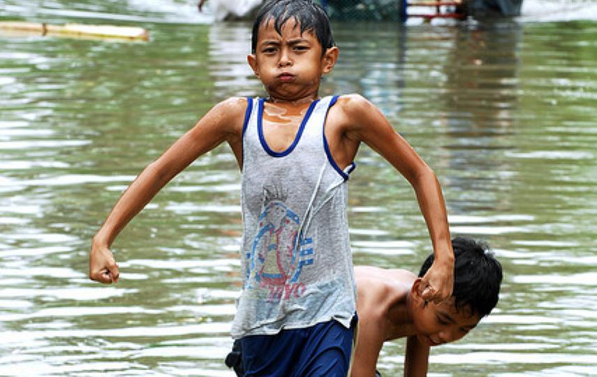 Residents of Los Baños and Bay towns, along the coast of Laguna de Bay and about 60 kilometers south of Manila, cope with floodwaters that have not receded 3 days after Typhoon Ondoy ravaged the Philippines