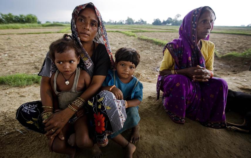 Woman who have been assisted by prgrammes run by Care International sit outside of their house in a village outside of Rupandehi, Nepal. 23rd June, 2010