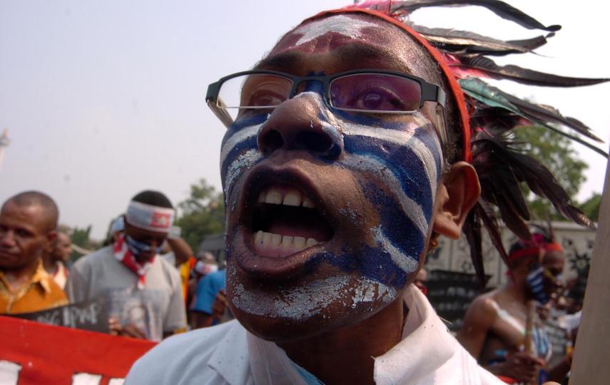 A Papuan woman demonstrates for greater autonomy in Jakarta. Local anger about inward migration continues, and there is a risk of a rekindling of separatist violence in Indonesia's easternmost province