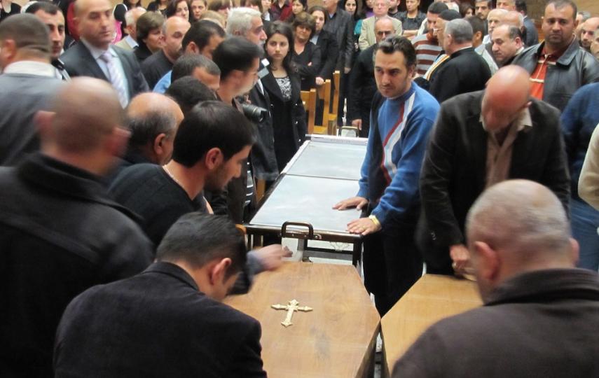 Mourners at an Ankawa funeral of a Christian couple killed by extremists in Baghdad