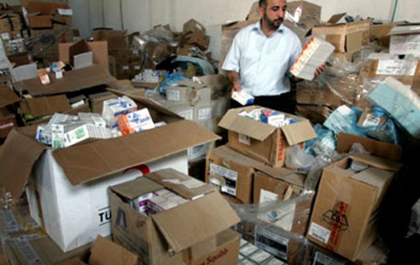 Officials from the Gaza health ministry sorting drugs and medical supplies donated to Gaza. Donated drugs are often expired or are not according to the needs, reports the World Health Organization (WHO) in Gaza