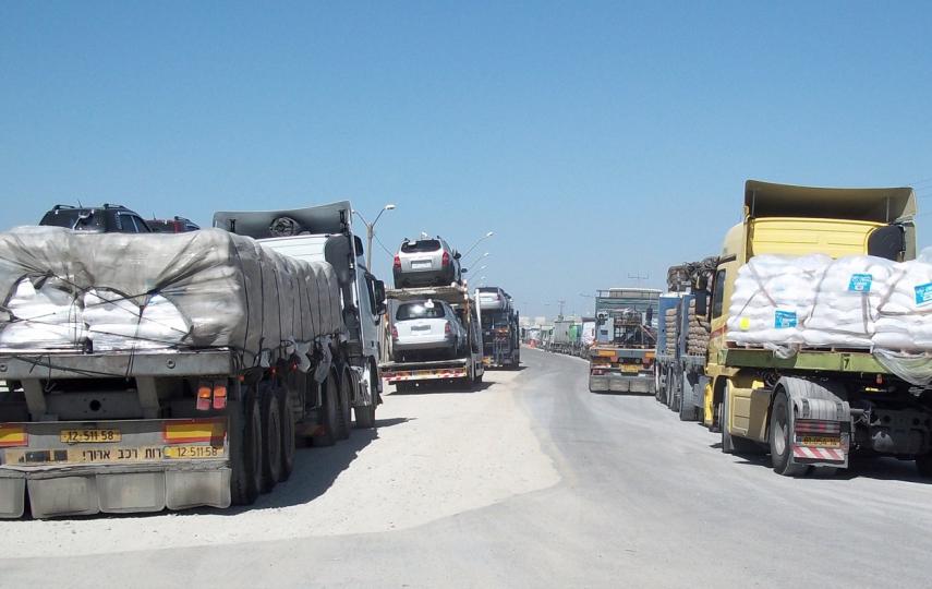Truckloads of humanitarian aid and commercial goods bottle-necked at at Kerem Shalom crossing along the Gaza-Israel border