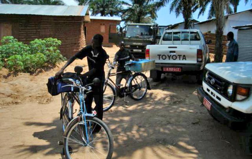 Two former child soldiers in Rumonge commune receive bicycles under the DDR programme