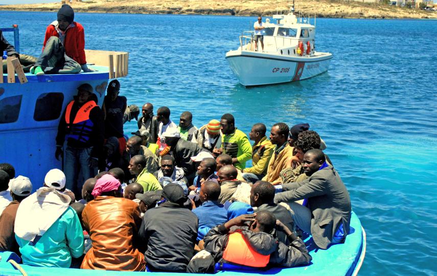 A boat carrying sub-Saharan African migrant workers arrives in Lampedusa from Tripoli