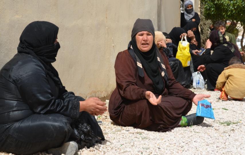 Syrians who fled to Jordan wait to register with the Jordan Red Crescent to receive assistance. Many Syrian refugees arrive with very little savings and need food and non-food items, as well as cash to rent apartments