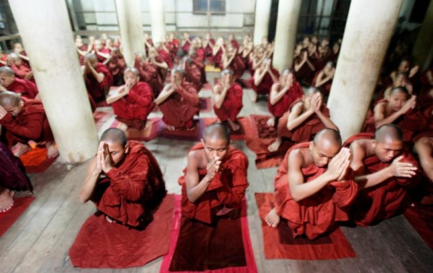 Buddhist monks gather for prayers at a Yangon temple