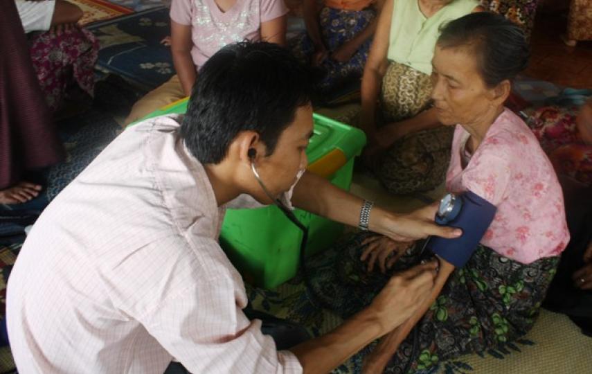 An MSF doctor treating an ethnic Rakhine woman in Sittwe