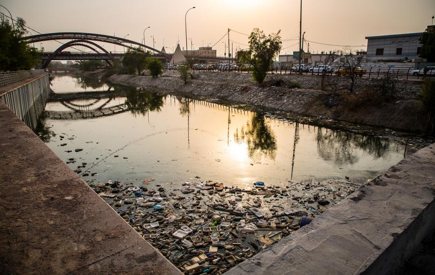 Basra water canal littered with trash, plastic and debris