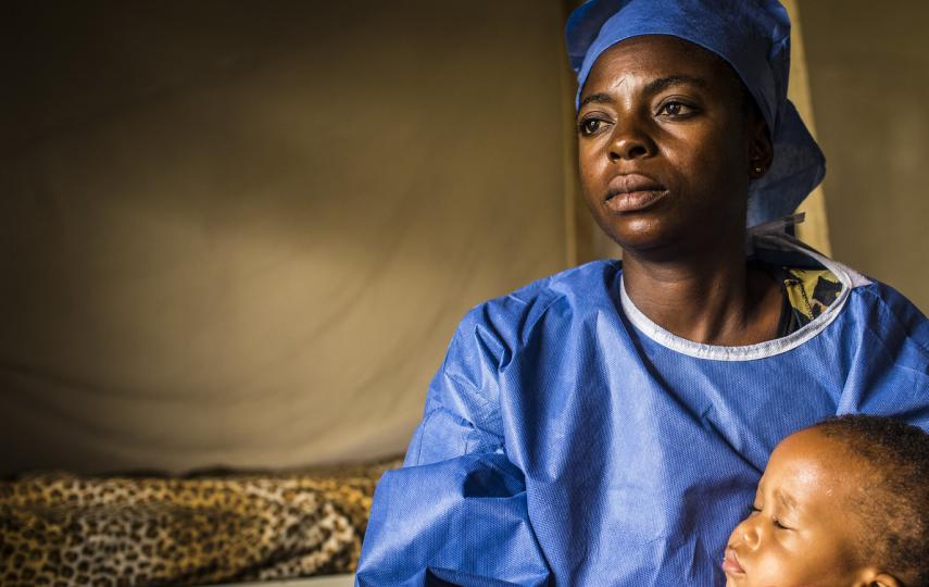 Photo of a child and caregiver in an Ebola treatment centre in Congo