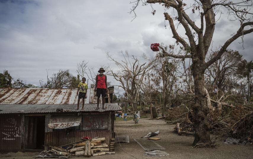 Man and child standing on roof