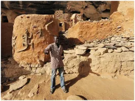 Malian journalist Mamadou Tapily speaks to tourists while working as a guide before a jihadist insurgency swept through large parts of his country from 2012 onwards.