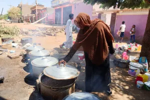 A Sudanese woman prepares food at “Takaya” the charity restaurant and a community kitchen, that help the needy Sudanese in Omdurman areas recently controlled by army during the conflict and war, during the holy month of Ramadan in the state of Khartoum Sudan March 14, 2025.