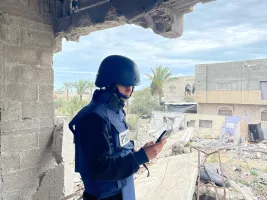 Rita Baroud wearing protective press gear out reporting in Deir al-Balah, Gaza.