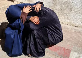 Palestinian women mourn a relative who was killed in an Israeli airstrike in Gaza City, on 7 May 2025.