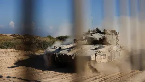 An Israeli tank manoeuvres before entering into the Gaza Strip, amid the ongoing conflict in Gaza between Israel and Hamas, at the Kerem Shalom crossing in southern Israel, November 11, 2024.