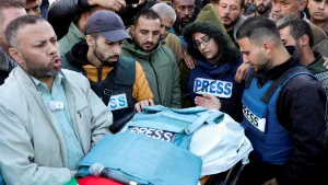 Mourners, including colleagues, attend the funeral of Ahmed al-Louh, a Palestinian video journalist for Al Jazeera TV who was killed in an Israeli strike in December 2024.