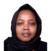 This is a headshot of Rahma Hassan. She is pictured looking at the camera with a calm expression. She wears a black headscarf.