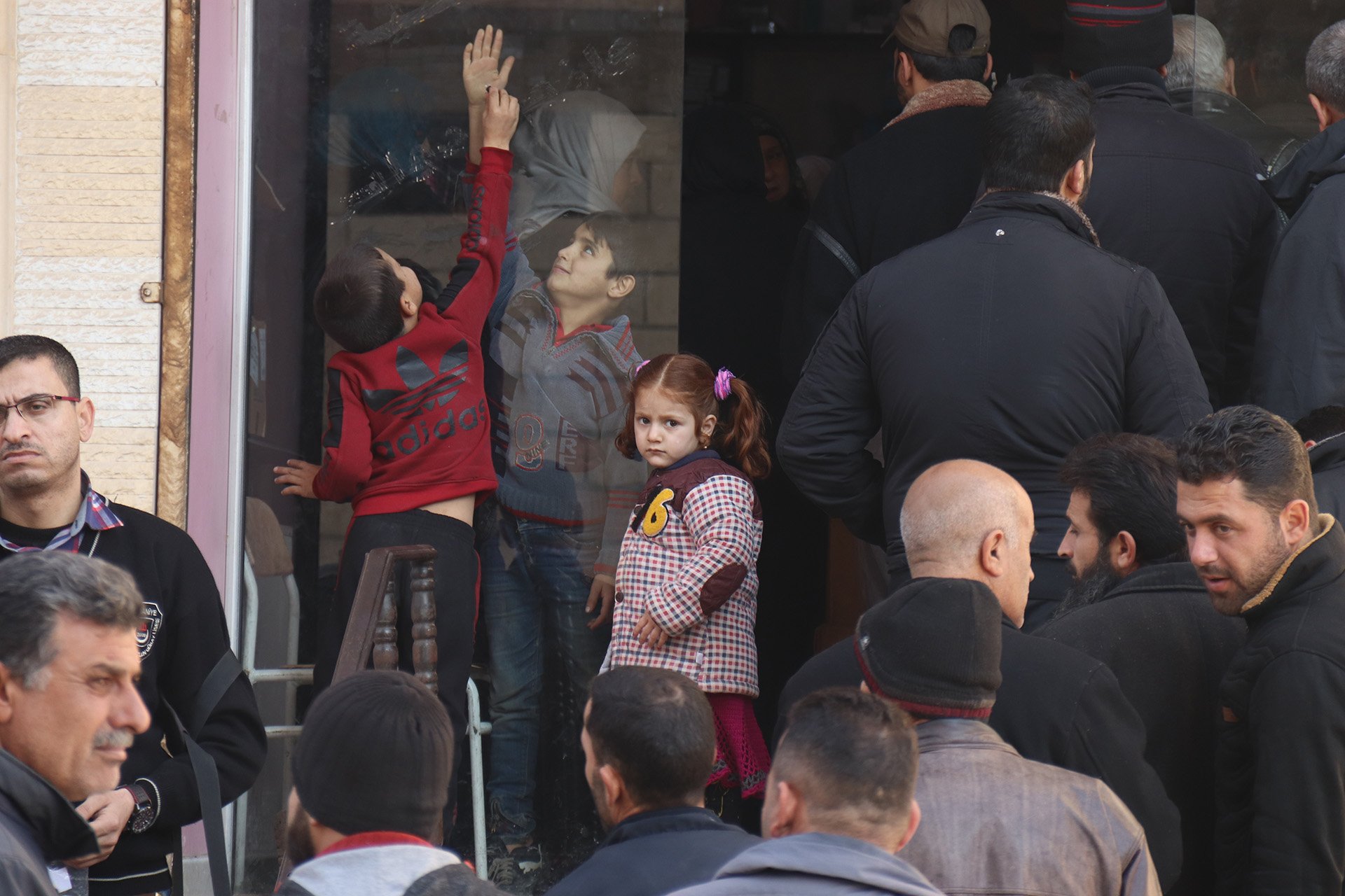 Dozens of Syrians gather outside the Aya Charity Pharmacy in Idlib city, some of them having travelled long distances in the hope of getting their hands on the free medication on offer that day.