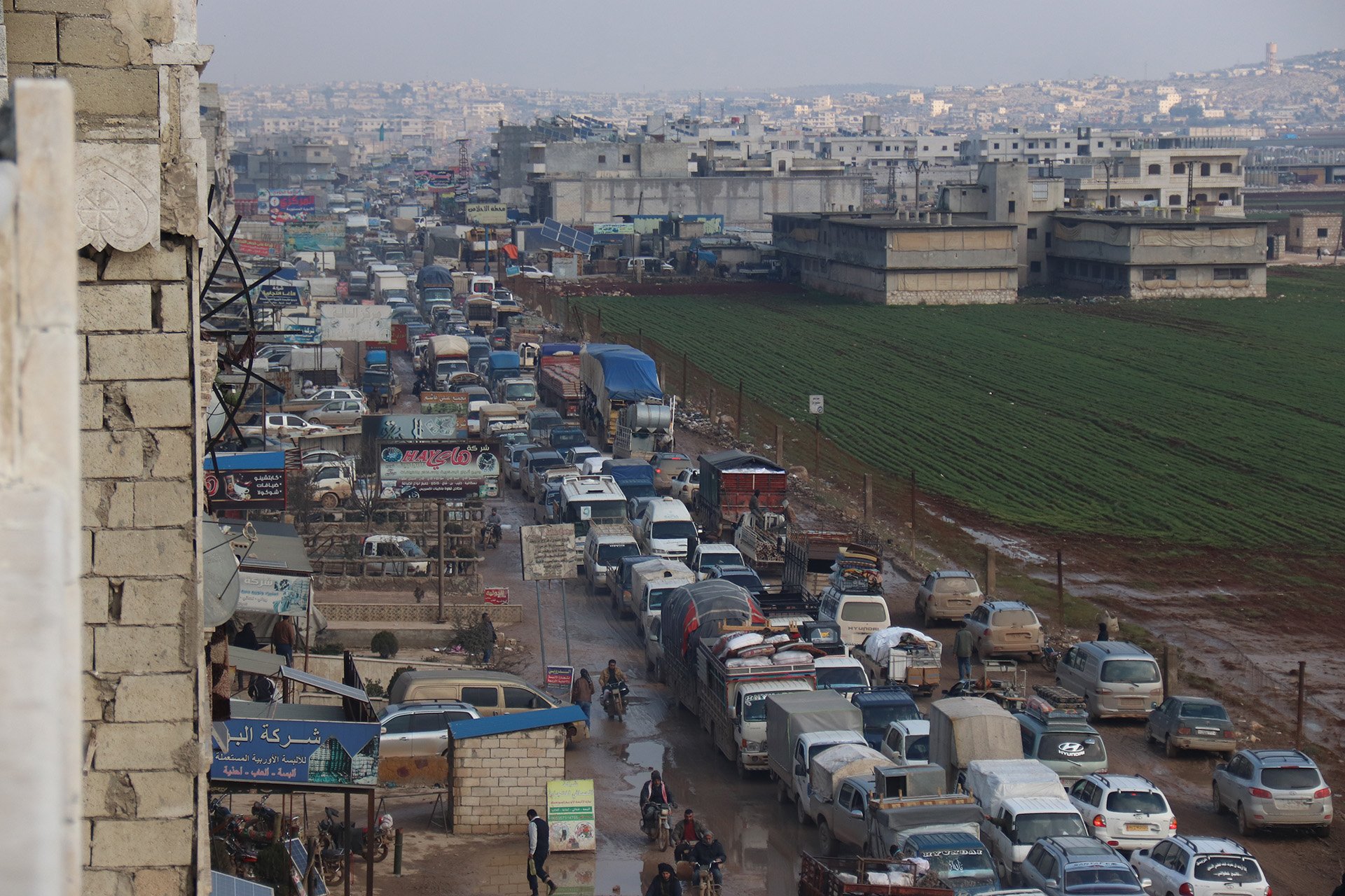 People fleeing towards Sarmada, a town in Idlib near the Syrian border with Turkey, on 10 February 2020.