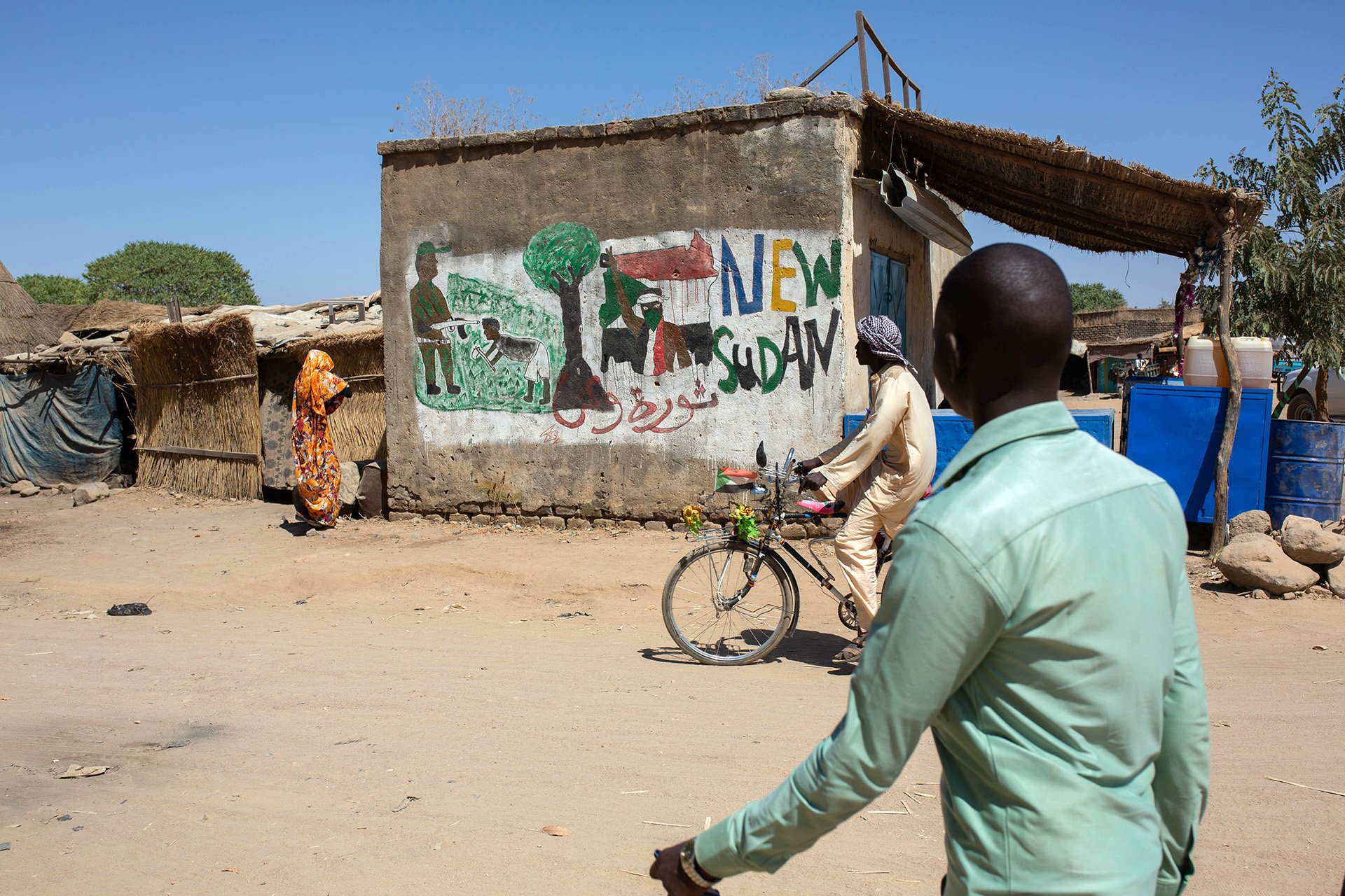 A mural from the 2019 revolution on the wall of a shop in Nertiti, a conflict-affected town in Darfur.