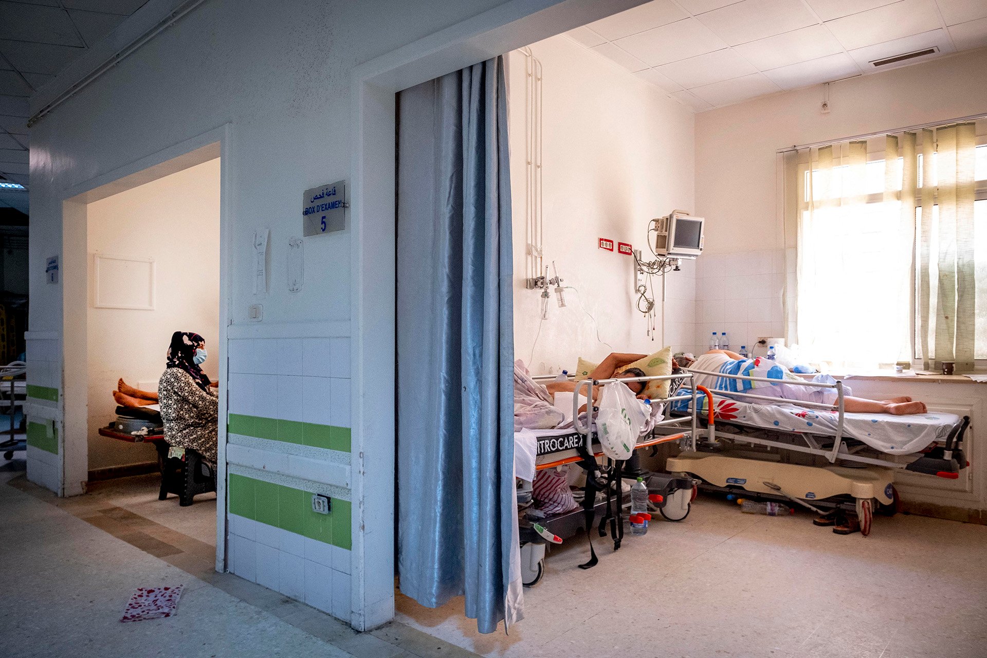 Patients at the Mongi Slim hospital in La Marsa, north of Tunis, where all available space – including hallways – is being used to treat COVID-19 cases, on 23 July 2021. 