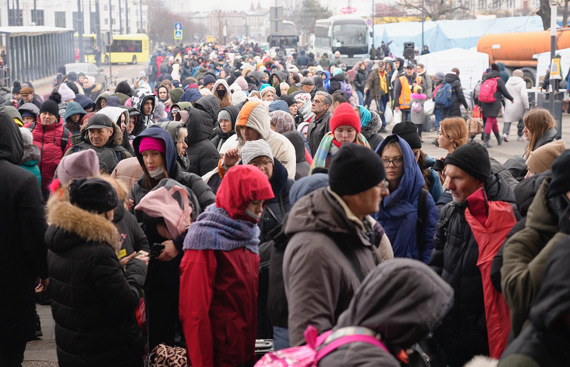 People at the railway station in Lviv wait in line for hours to board trains to leave Ukraine.